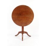 Property of a gentleman - a 19th century French cherrywood circular tilt-top table with turned