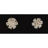 A pair of diamond flowerhead cluster earrings, with post & butterfly fastenings, the estimated total