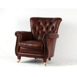 Property of a deceased estate - a modern leather upholstered armchair, with square tapering front