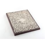 Property of a gentleman - a modern silver faced leather folding blotter, with repousse decoration