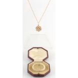 Property of a lady of title - an early 20th century yellow gold seed pearl pendant on chain