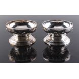 Property of a lady - a pair of silver circular pedestal salts by Anne Tanqueray, with cut card