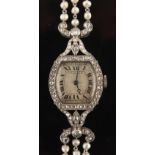 Cartier - an early 20th century Belle Epoque platinum & diamond cocktail wristwatch by Cartier,
