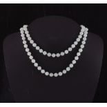 Property of a gentleman - a pale jadeite uniform single strand bead necklace, the eighty-five