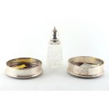 Property of a lady - two modern silver coasters with turned wood bases, each with engraved initials,