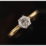 An 18ct yellow gold diamond single stone ring, the round brilliant cut diamond weighing