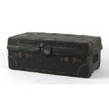 A George III leather & brass studded trunk, with printed lining, 32ins. (81cms.) wide (overall).
