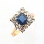 A yellow gold sapphire & diamond cluster ring, the octagonal cut sapphire weighing an estimated 1.64