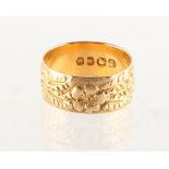 Property of a lady - an 18ct gold fancy band ring, size N/O, approximately 4.4 grams.