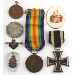 Property of a lady - a bag containing assorted militaria including a silver & enamel H.M.S.