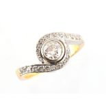 An 18ct yellow gold diamond crossover ring, the estimated total diamond weight 0.60 carat, size L,