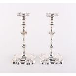 Property of a lady - a pair of George II style silver candlesticks, with detachable nozzles, J.B.
