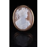 Property of a deceased estate - an unmarked yellow gold oval shell cameo brooch depicting a