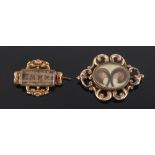 Property of a lady - two Victorian yellow metal mourning brooches, with braided hair panels, the