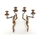 Property of a gentleman - a pair of French Louis XV style ormolu rocaille twin light wall appliques,