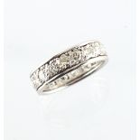 A platinum or white gold diamond eternity ring, the eighteen round brilliant cut diamonds weighing