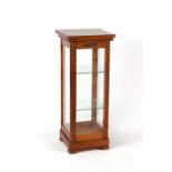 Property of a deceased estate - a modern glazed square section display cabinet, 33.7ins. (85.