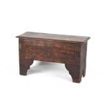 A late 17th / early 18th century oak 6-plank coffer or sword chest, with later carved decoration,