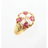 A Victorian 18ct yellow gold ruby & diamond ring, with four round cut rubies alternating with four