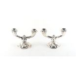 Property of a lady - a pair of Continental 835 grade silver dwarf candelabra, 4.5ins. (11.5cms.)