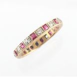 An eternity ring set with red & clear 'stones' (not diamonds), size Q.