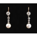 A pair of diamond & pearl pendant drop earrings, each with a single pearl suspended below four