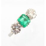 A good certificated Colombian emerald & diamond three stone ring, the octagonal cut emerald of
