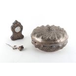 Property of a deceased estate - a Continental 800 grade silver circular box, with repousse floral