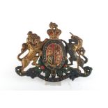 Property of a lady - a painted cast iron Royal coat of arms, late 19th / early 20th century, 9.5ins.