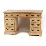 Property of a gentleman - a late Victorian pine twin pedestal desk, with nine drawers, 48.8ins. (
