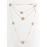 An 18ct rose gold diamond & pearl necklace, with beaded circular panels each enclosing a pearl