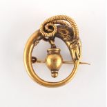 Property of a deceased estate - a yellow gold (tests 18ct) ram's head brooch, interlinked DG (?)