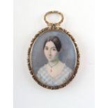 Property of a deceased estate - a 19th century ornate yellow metal framed portrait miniature on