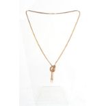 Property of a lady - a modern 9ct two colour gold twin tassel necklace, 18ins. (46cms.) long,