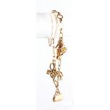 Property of a lady - a 9ct gold charm bracelet with three charms (one unmarked), with safety