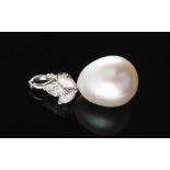 A large pearl & diamond pendant, the pear shaped pearl measuring approximately 15 by 12.5 by 12.5mm,