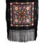 Property of a gentleman - a Chinese floral embroidered black silk shawl, late 19th / early 20th