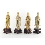 Property of a deceased estate - a group of four Chinese carved soapstone figures of Guanyin, the