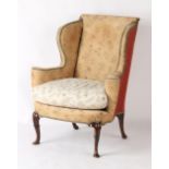 Property of a deceased estate - a George II style upholstered wing armchair (with loose covers in