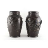 Property of a gentleman - a pair of late 19th / early 20th century Japanese bronze vases decorated