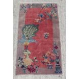 Property of a lady - an early / mid 20th century Chinese hand knotted rug, decorated with birds on a