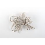 A fine & large platinum & diamond floral spray brooch, the round brilliant & baguette cut diamonds