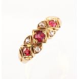 A Victorian 18ct yellow gold ruby & diamond ring, the three oval cushion cut rubies weighing an