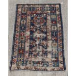 Property of a lady - an antique Shirvan rug, worn, 75 by 49ins. (191 by 124cms.).