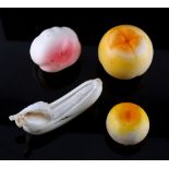 Property of a lady - four Japanese carved ivory models of fruit, late 19th / early 20th century, the