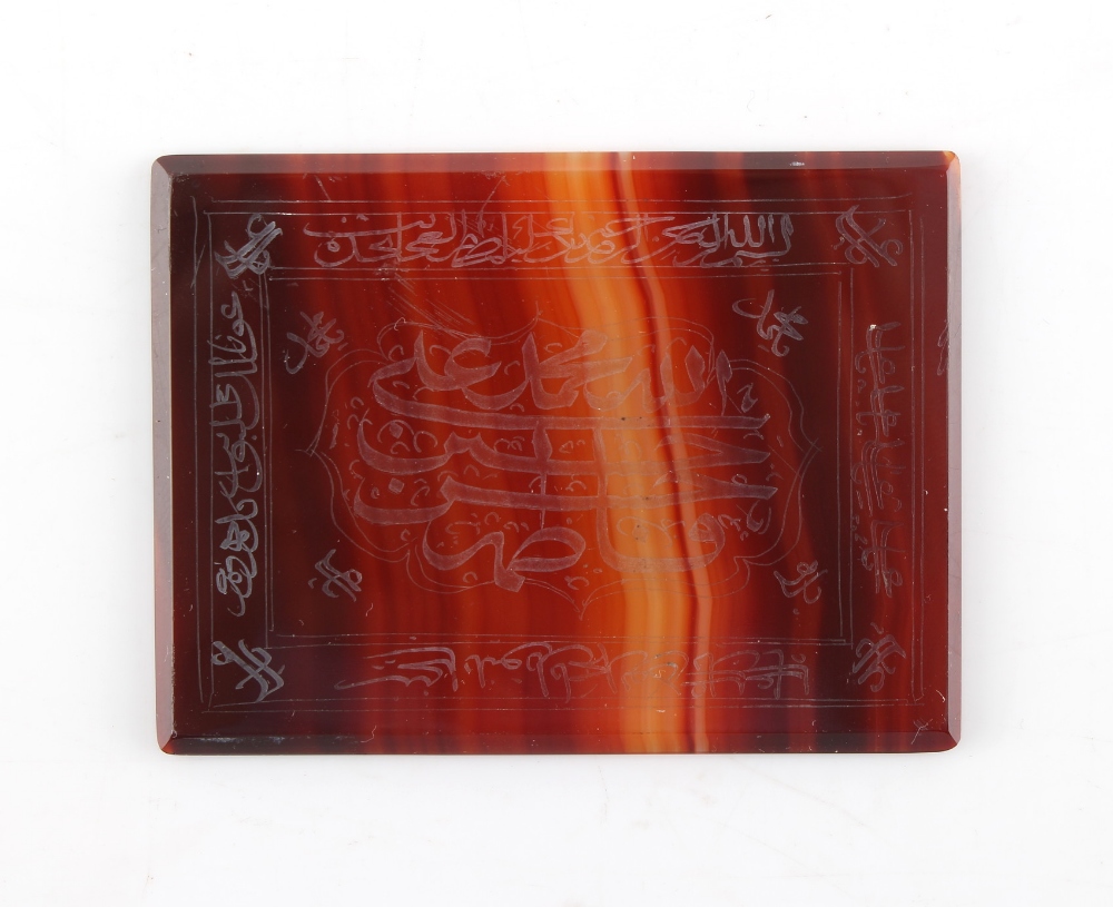 Property of a gentleman - a rectangular banded agate panel with engraved or etched Arabic or Islamic