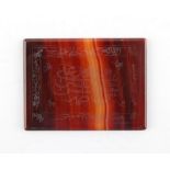Property of a gentleman - a rectangular banded agate panel with engraved or etched Arabic or Islamic