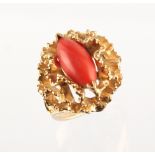 A modern 14ct yellow gold coral ring, approximately 10.7 grams, size M.