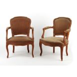 Property of a lady - a pair of Louis XV style fauteuils with sprung seats (2).