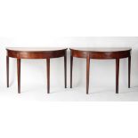 Property of a gentleman - a pair of George III mahogany demi lune tables, with square tapering legs,